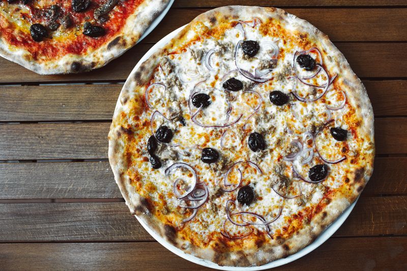 BBQ chicken pizza with smoked chicken and red onion