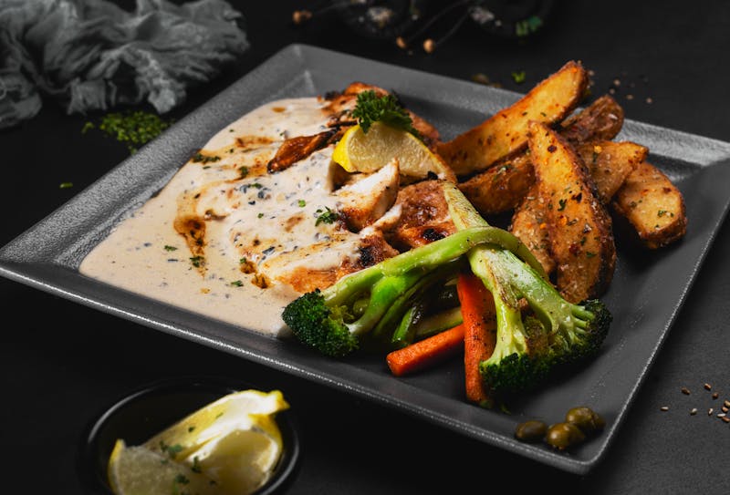 Coal roasted half chicken with roasted vegetables